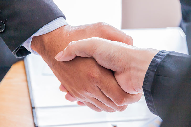 Business people shaking hands.
